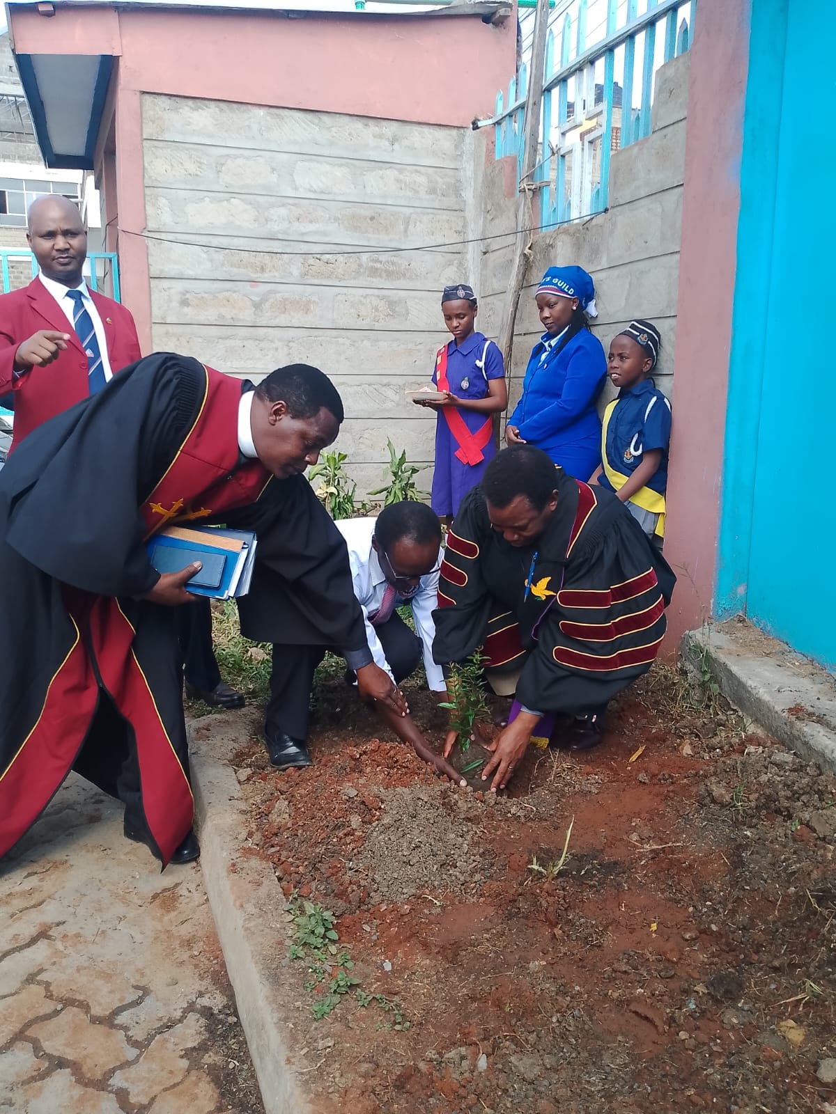 Boys and Girls Brigade planting a tree at the church